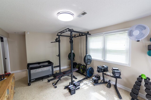 6330 Gardner Rd, Chandler, IN 47610 - exercise area with baseboards and a textured ceiling
