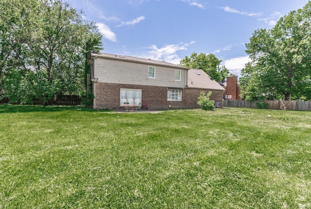 7860 Cedar Ridge Dr, Evansville, IN 47715 - rear view of house with a patio area and brick siding