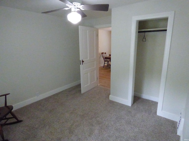 51044 Portage Rd, South Bend, IN 46628 - unfurnished bedroom featuring carpet flooring, baseboards, ceiling fan, and a closet
