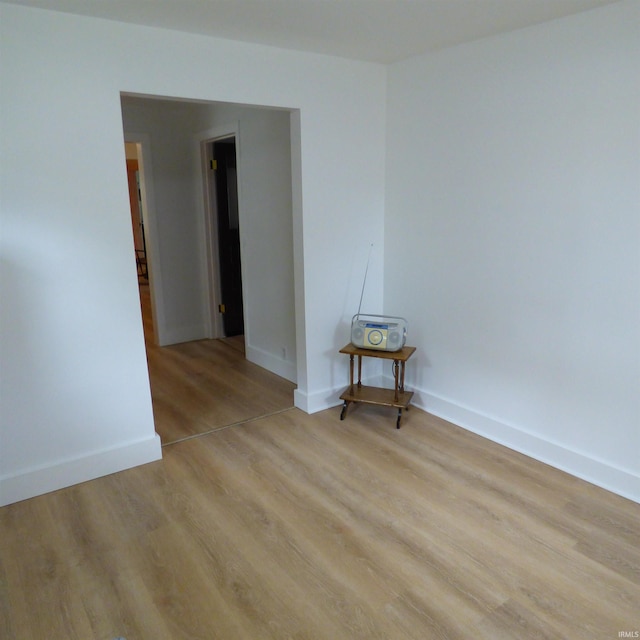 51044 Portage Rd, South Bend, IN 46628 - empty room with light wood-style flooring and baseboards