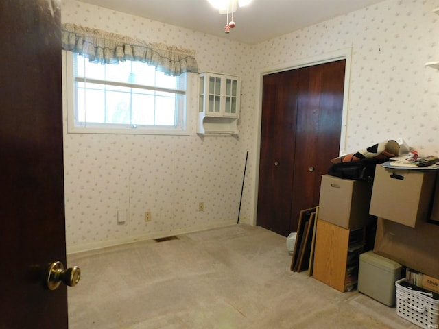 1702 Valley View Dr, Bedford, IN 47421 - carpeted bedroom with wallpapered walls and a closet