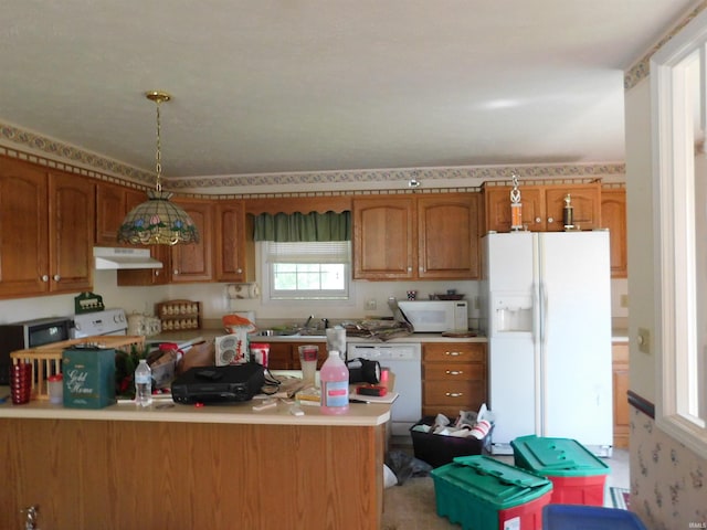 1702 Valley View Dr, Bedford, IN 47421 - kitchen with white appliances, under cabinet range hood, brown cabinets, light countertops, and a sink