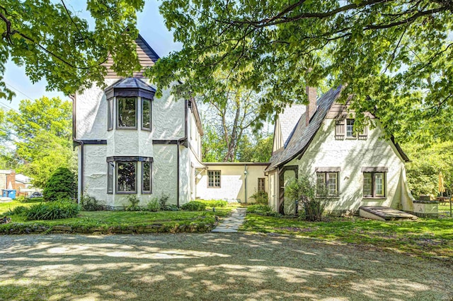 4302 Kessler Blvd N Drive, Indianapolis, IN 46220 - tudor home featuring stucco siding and a chimney
