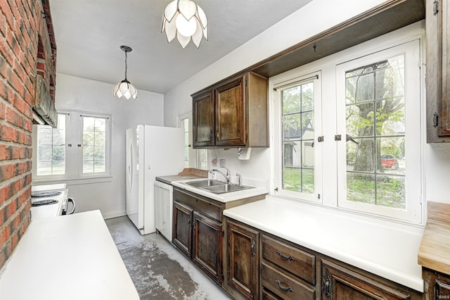 4302 Kessler Blvd N Drive, Indianapolis, IN 46220 - kitchen with a sink, white appliances, plenty of natural light, light countertops, and brick wall