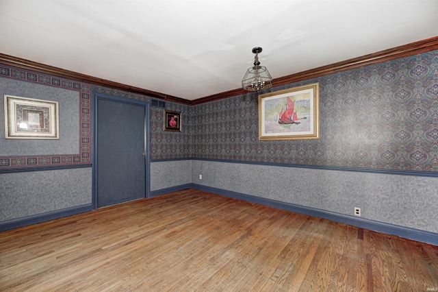 4302 Kessler Blvd N Drive, Indianapolis, IN 46220 - unfurnished room featuring light wood-type flooring, wallpapered walls, and crown molding
