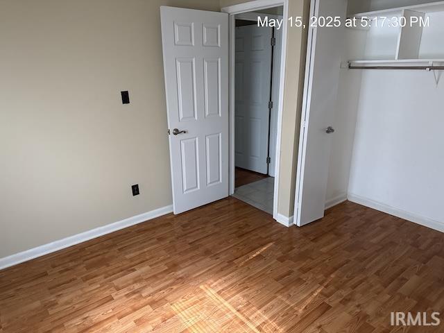4415 Richfield Ln, Fort Wayne, IN 46816 - unfurnished bedroom featuring wood finished floors, baseboards, and a closet