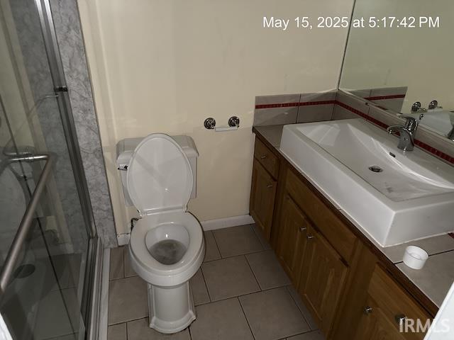 4415 Richfield Ln, Fort Wayne, IN 46816 - bathroom with vanity, tile patterned flooring, a shower stall, toilet, and baseboards
