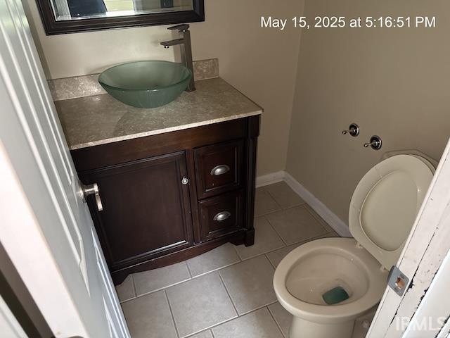 4415 Richfield Ln, Fort Wayne, IN 46816 - half bathroom with tile patterned flooring, vanity, and toilet