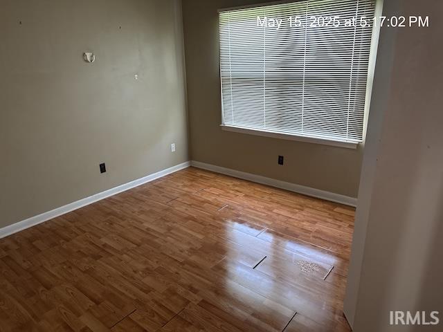 4415 Richfield Ln, Fort Wayne, IN 46816 - unfurnished room featuring baseboards and wood finished floors