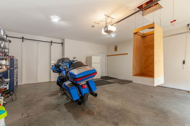 224 Aqueduct Cir, West Lafayette, IN 47906 - garage with freestanding refrigerator and a garage door opener