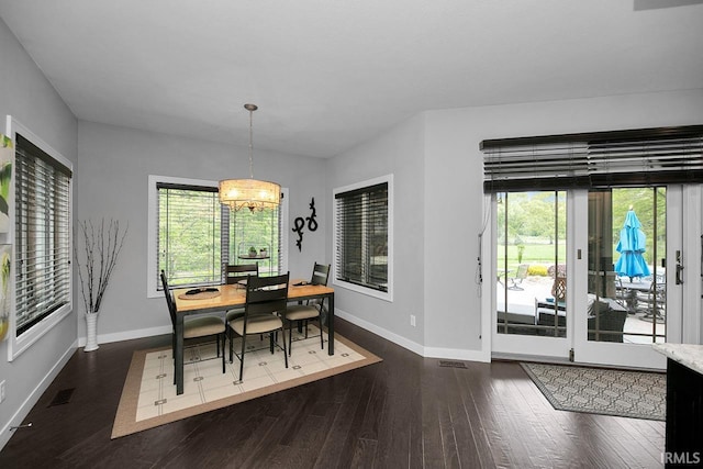 19861 County Road 16, Bristol, IN 46507 - dining room featuring baseboards, a chandelier, and healthy amount of natural light