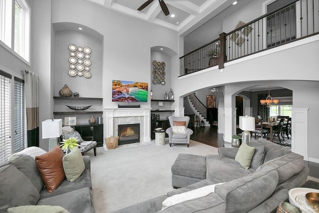 19861 County Road 16, Bristol, IN 46507 - living room featuring a high ceiling, a ceiling fan, stairway, arched walkways, and beamed ceiling