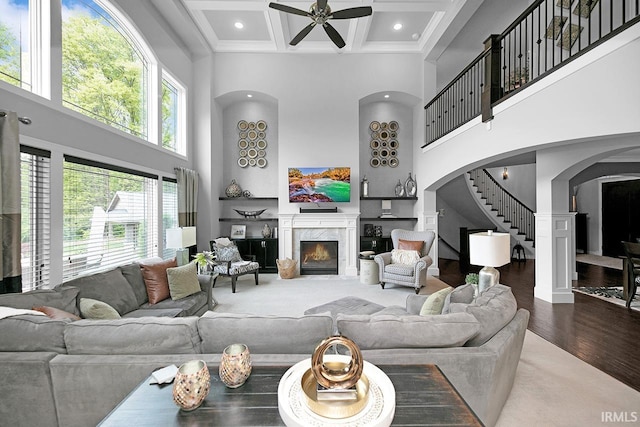 19861 County Road 16, Bristol, IN 46507 - living room with a towering ceiling, a premium fireplace, coffered ceiling, a ceiling fan, and wood finished floors