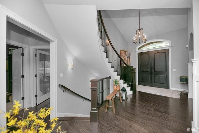 19861 County Road 16, Bristol, IN 46507 - foyer entrance with wood finished floors, lofted ceiling, baseboards, a chandelier, and stairway
