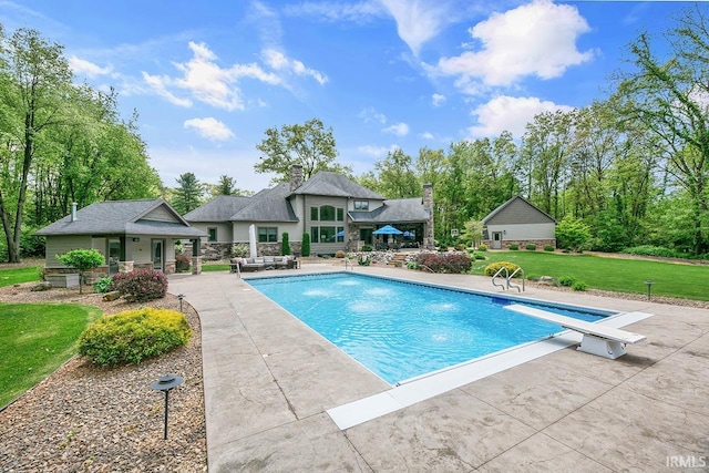 19861 County Road 16, Bristol, IN 46507 - outdoor pool with a yard, a patio area, and a diving board