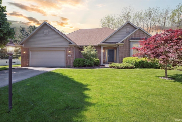 1916 Greenwood Dr, Goshen, IN 46526 - view of front of house with brick siding, a garage, and concrete driveway