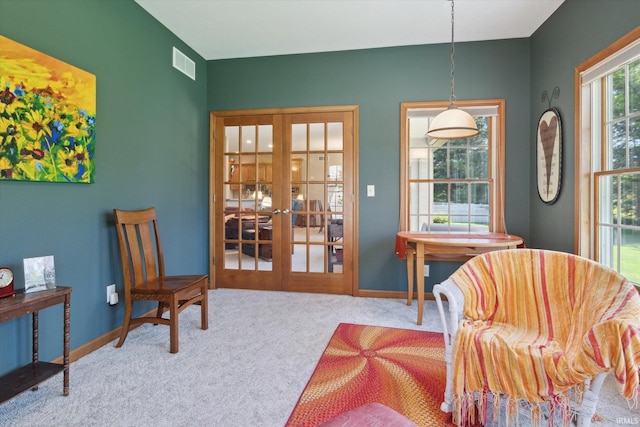 1916 Greenwood Dr, Goshen, IN 46526 - sitting room featuring french doors, carpet floors, and baseboards