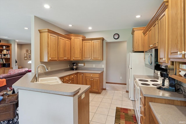 1916 Greenwood Dr, Goshen, IN 46526 - kitchen with a sink, stainless steel microwave, electric range, a peninsula, and recessed lighting