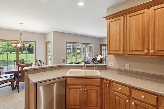 1916 Greenwood Dr, Goshen, IN 46526 - kitchen with stainless steel dishwasher, a sink, a peninsula, a chandelier, and brown cabinetry