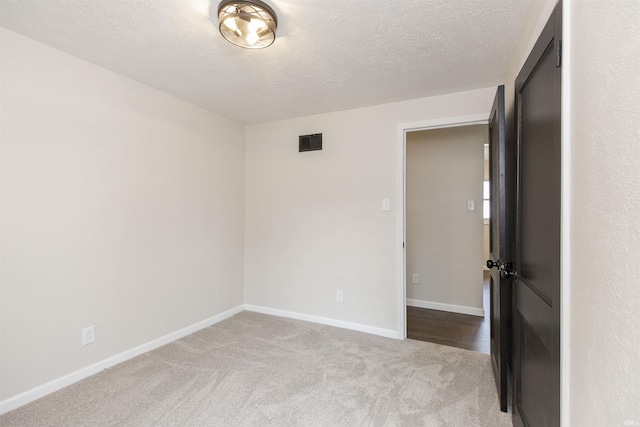 121 Palau St, Mishawaka, IN 46545 - carpeted spare room with baseboards and a textured ceiling