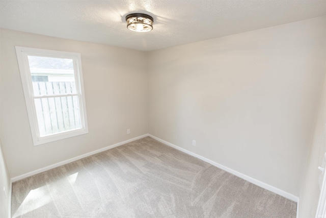 121 Palau St, Mishawaka, IN 46545 - unfurnished room featuring carpet floors, baseboards, and a textured ceiling