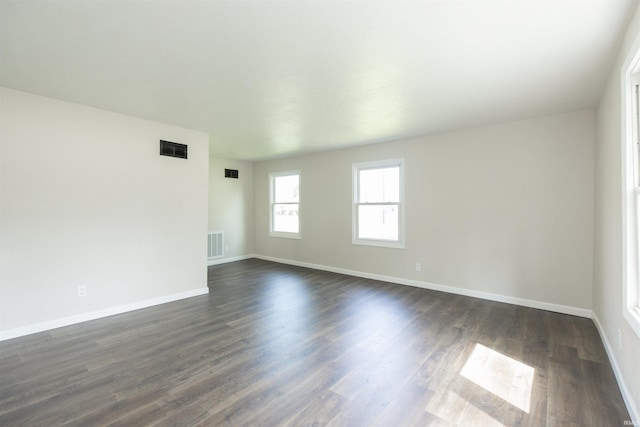 121 Palau St, Mishawaka, IN 46545 - spare room featuring baseboards and dark wood finished floors