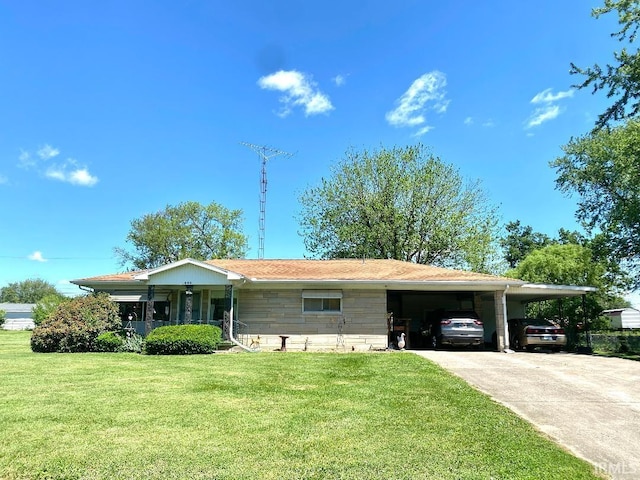 260 W Prairie St, Lyons, IN 47443 - ranch-style home with a front yard, a carport, and concrete driveway