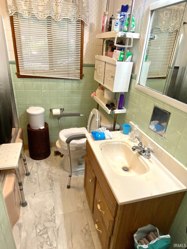 260 W Prairie St, Lyons, IN 47443 - bathroom with tile walls, vanity, toilet, marble finish flooring, and a shower