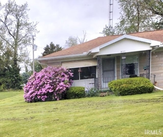 260 W Prairie St, Lyons, IN 47443 - view of front facade featuring a front yard, a porch, and a garage