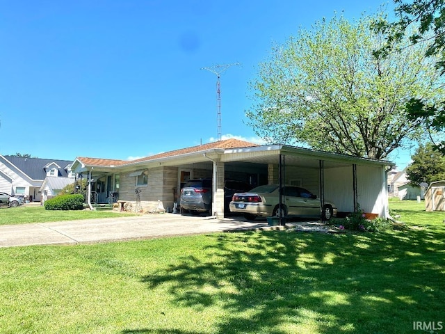 260 W Prairie St, Lyons, IN 47443 - view of front of home featuring a front lawn, driveway, and a carport