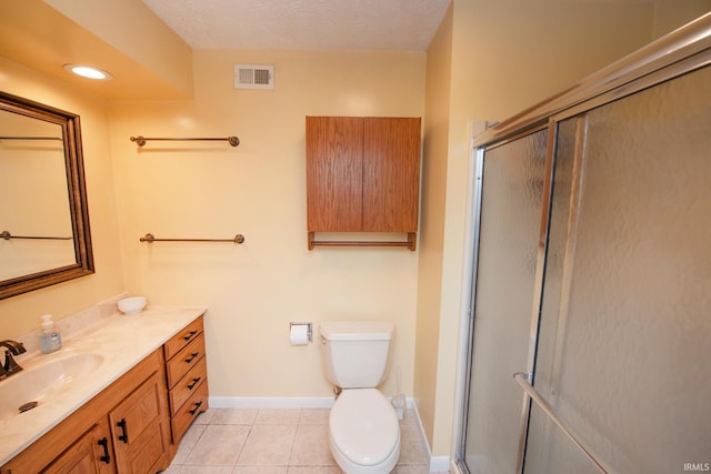 full bath with a stall shower, tile patterned flooring, vanity, toilet, and baseboards