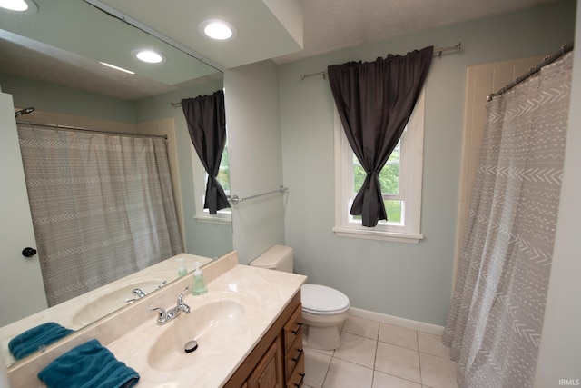 full bathroom with tile patterned flooring, toilet, baseboards, vanity, and recessed lighting