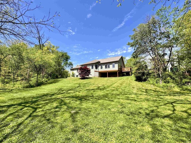 5936 County Road 427, Auburn, IN 46706 - back of property featuring a wooden deck and a yard
