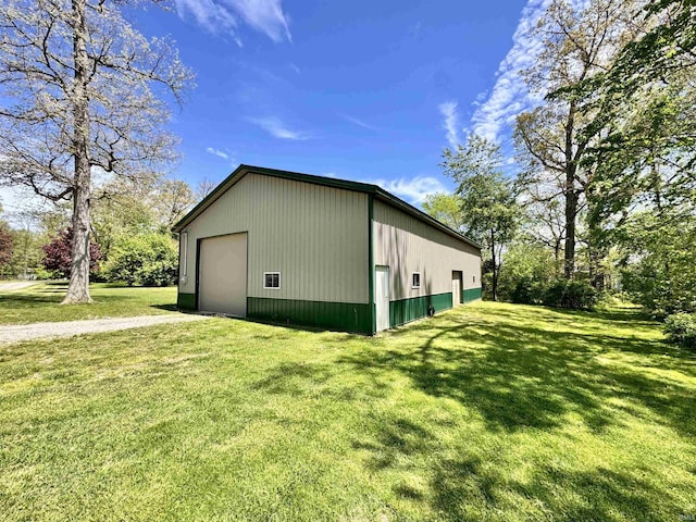 5936 County Road 427, Auburn, IN 46706 - view of home's exterior with an outdoor structure, a lawn, and an outbuilding