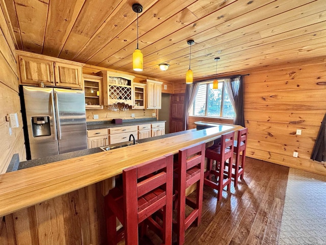 5936 County Road 427, Auburn, IN 46706 - kitchen with stainless steel refrigerator with ice dispenser, wood ceiling, glass insert cabinets, dark wood finished floors, and a kitchen breakfast bar