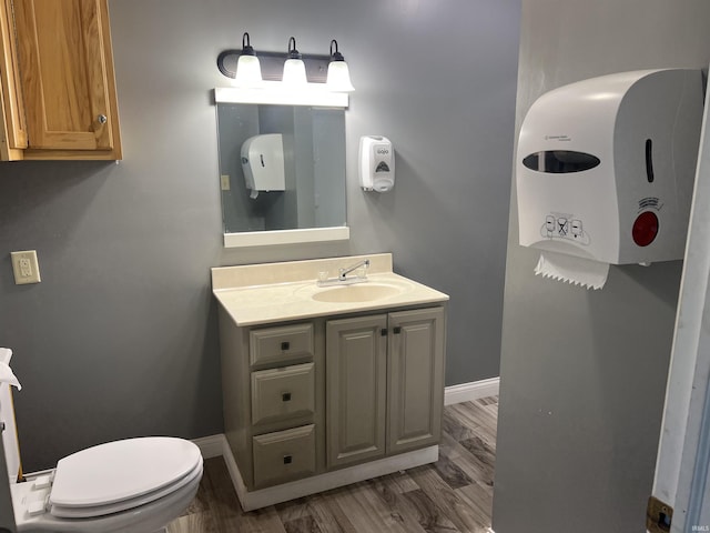 5861 Jordan Village Rd, Poland, IN 47868 - half bathroom with vanity, wood finished floors, toilet, and baseboards