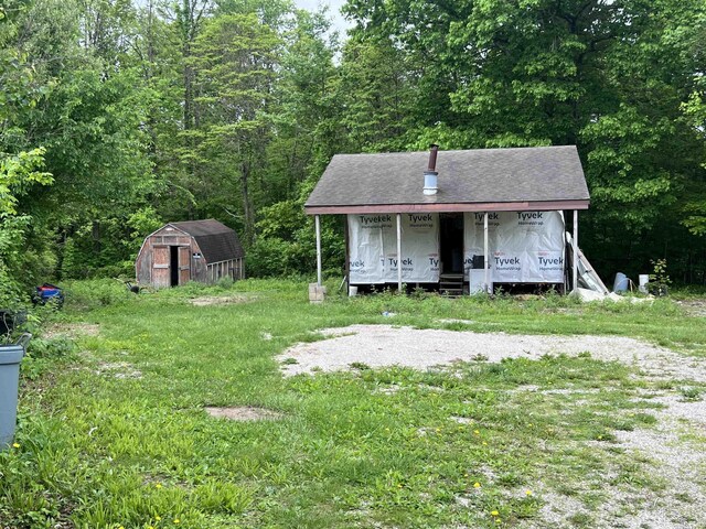 5861 Jordan Village Rd, Poland, IN 47868 - view of front of home with a shed, an outbuilding, and a wooded view