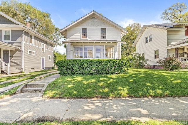 view of front facade featuring a front yard