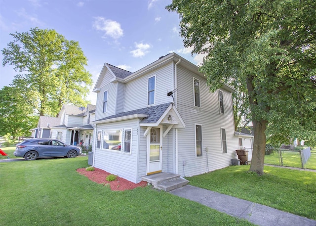 201 N Gonser Ave, Ashley, IN 46705 - view of front facade featuring a shingled roof