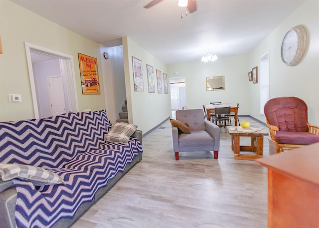 201 N Gonser Ave, Ashley, IN 46705 - living room featuring wood finished floors, stairway, and ceiling fan