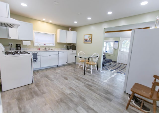 201 N Gonser Ave, Ashley, IN 46705 - kitchen with white appliances, a sink, white cabinets, recessed lighting, and light countertops