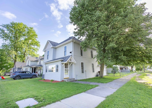 201 N Gonser Ave, Ashley, IN 46705 - view of front facade with a shingled roof