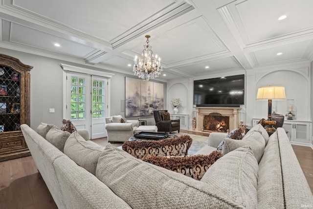 living area featuring coffered ceiling, wood finished floors, a premium fireplace, crown molding, and beam ceiling