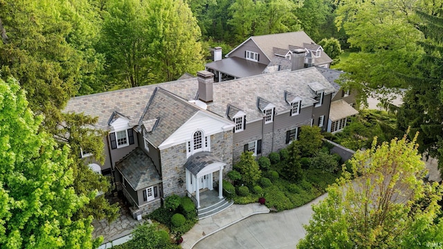 view from above of property with a heavily wooded area
