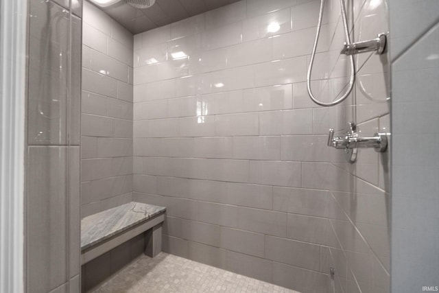 bathroom with tiled shower