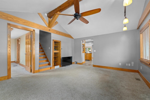 845 N Wayne St, Waterloo, IN 46793 - unfurnished living room with carpet, a ceiling fan, a fireplace, stairway, and baseboards