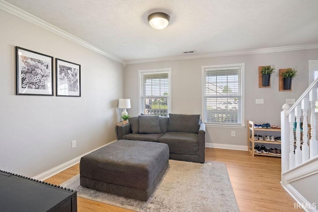 3154 Sand Walk Dr, Kokomo, IN 46902 - living room featuring ornamental molding, light wood-type flooring, stairway, and baseboards