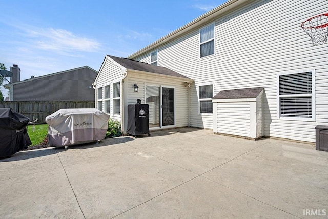 3154 Sand Walk Dr, Kokomo, IN 46902 - rear view of property with fence, a patio area, a storage unit, and an outbuilding