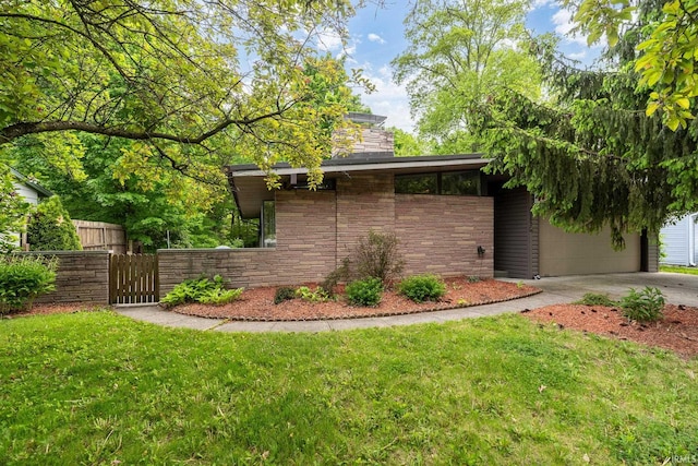 view of front of property featuring concrete driveway, a gate, an attached garage, and stone siding