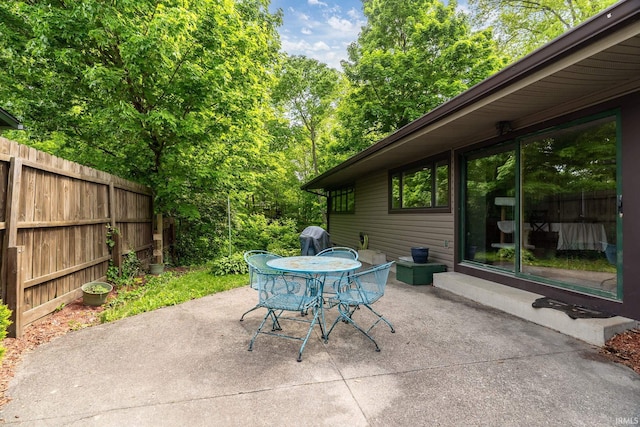 view of patio / terrace with outdoor dining area and fence